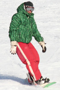 Solid colours and different patterns on snowboarder