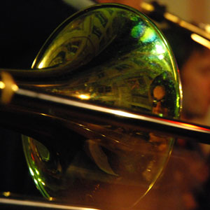 Reflection of trombone player in trombone