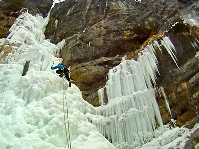 <Picture of a cliff covered in icicles being climbed>
