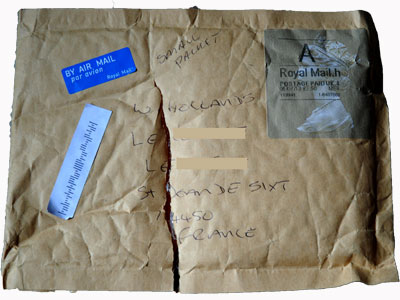 <Photo of a package damaged in transit that nobody seems to be responsible for>