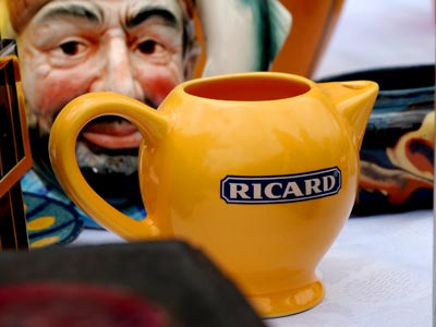 <Photo of glass Ricard jugs also on offer at the Le Grand Bornand vide grenier, France'>