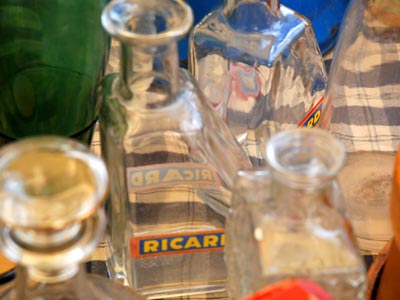 <Photo of glass Ricard jugs also on offer at the Le Grand Bornand vide grenier, France'>