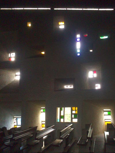 <Photo of interior windows at Notre Dame du Haut, in France'>