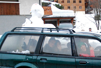 Snowman on car in La Clusaz