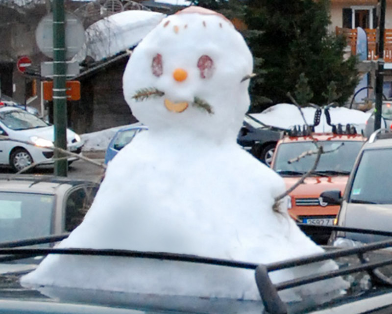 Snowman on a car